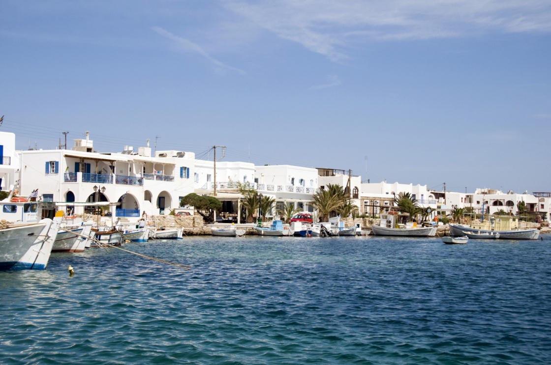 'the beautiful  classic port harbor of antiparos island in the cyclades greece with boats and hotels and classic greek island architecture' - Πάρος